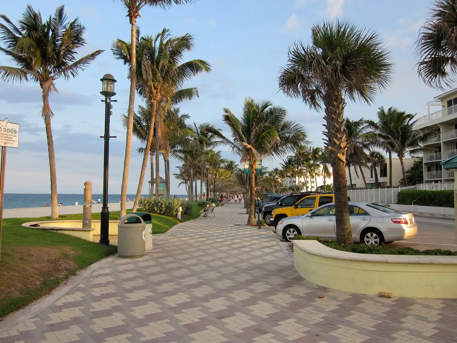 Palm-lined beachfront promenade beside the ocean in Deerfield Beach, FL