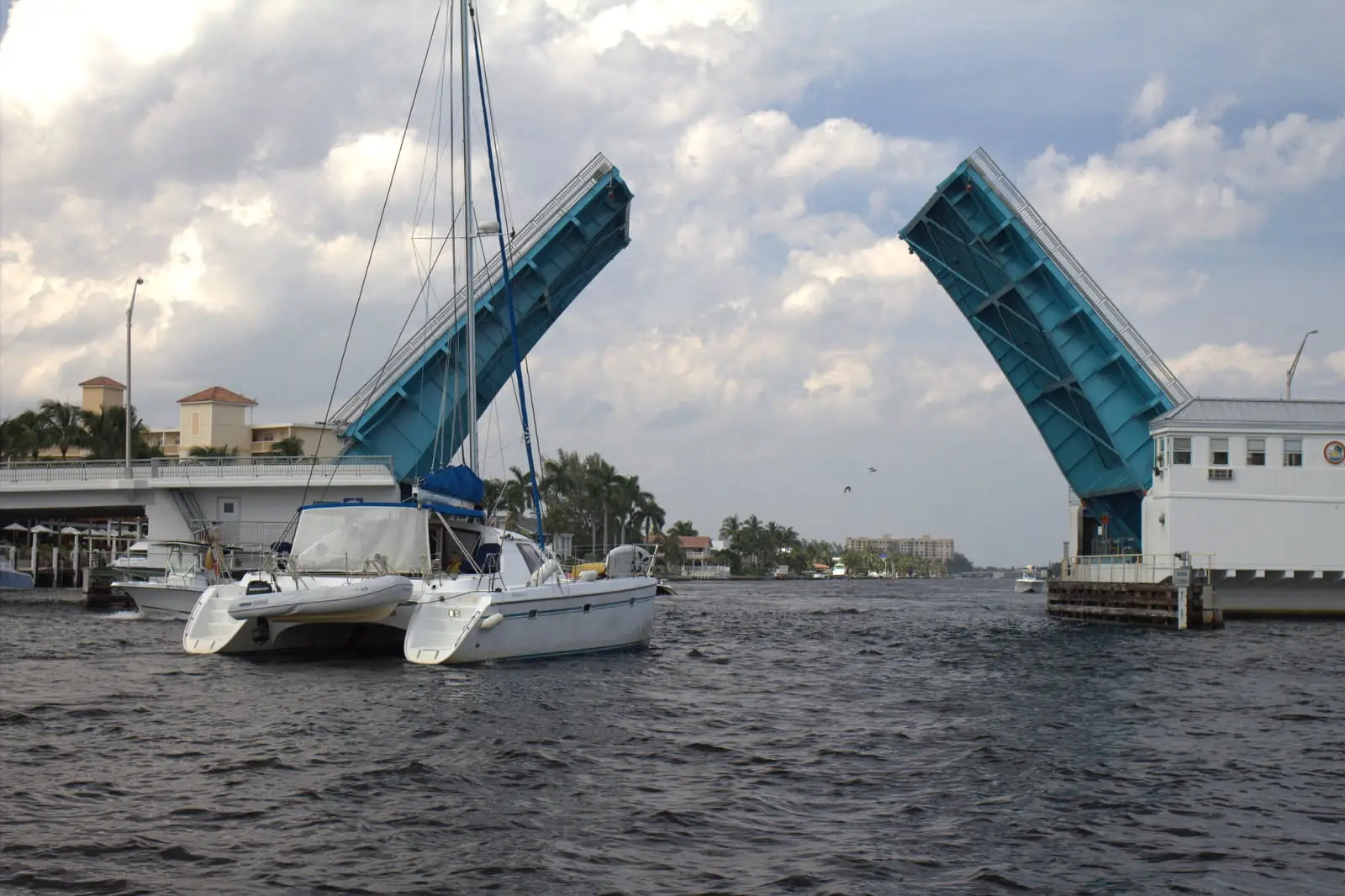 The Atlantic Boulevard drawbridge raised over the Intracoastal for a catamaran in Pompano Beach, FL